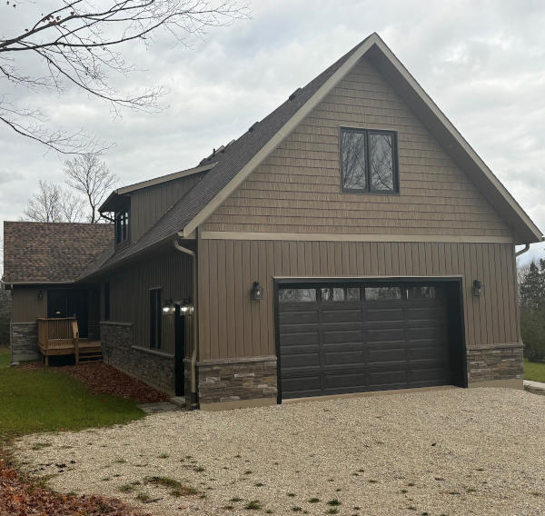 mulmer-house-garage-1 back of mulmer house showing garage and siding